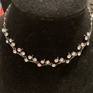 Delicate and swooping necklace with multi stone drop earrings